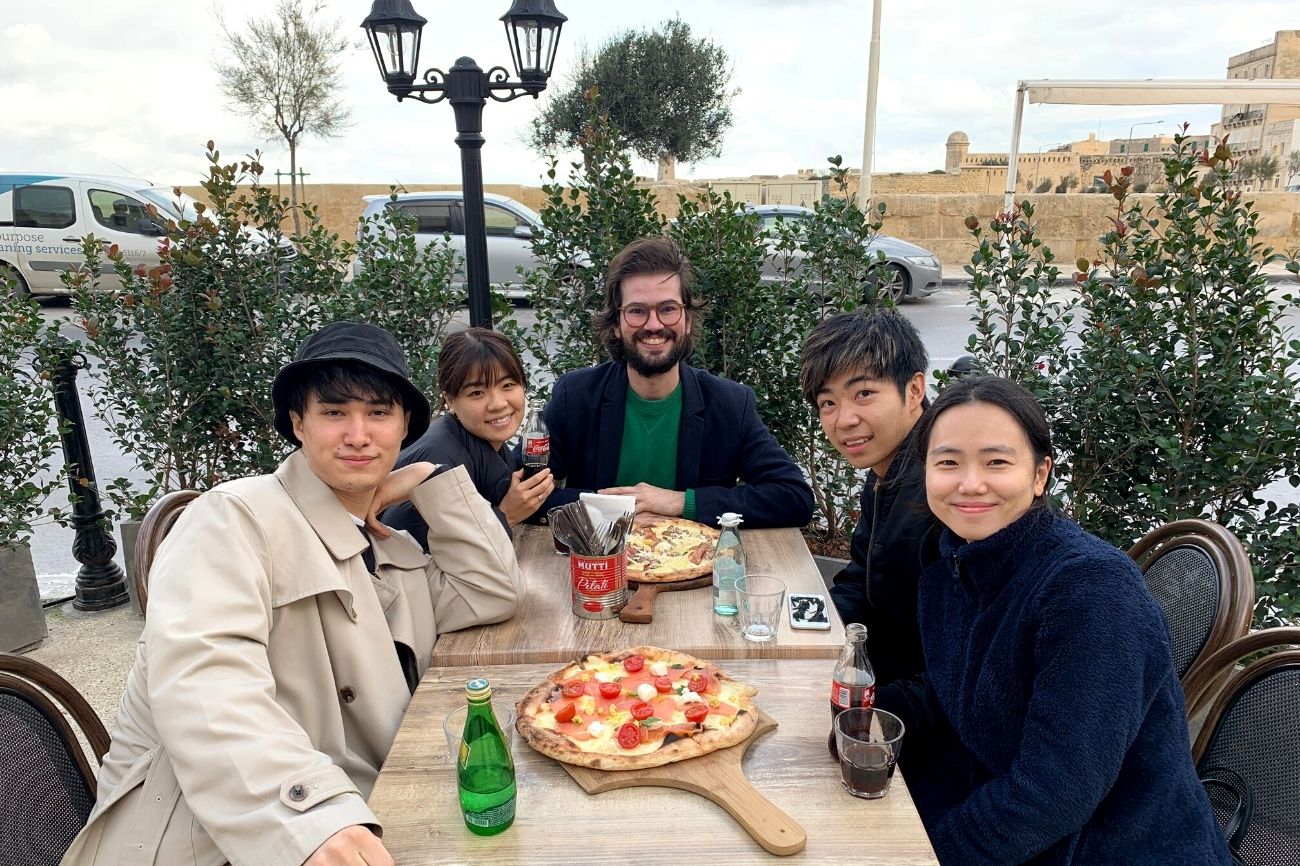 yudia and other students having dinner